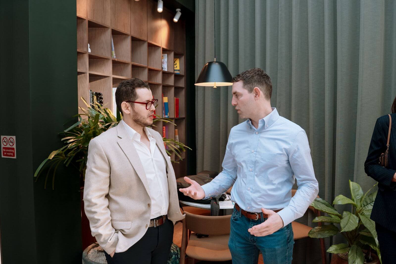 A conversation between guests during the summit