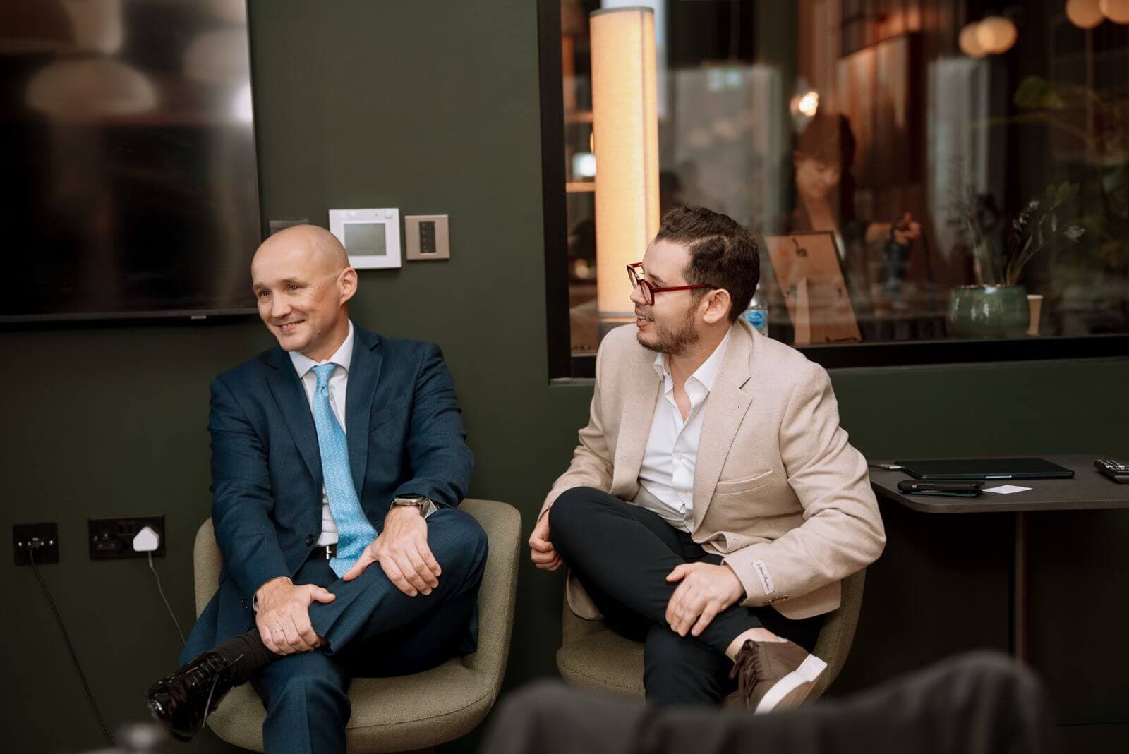 A conversation between guests at the summit